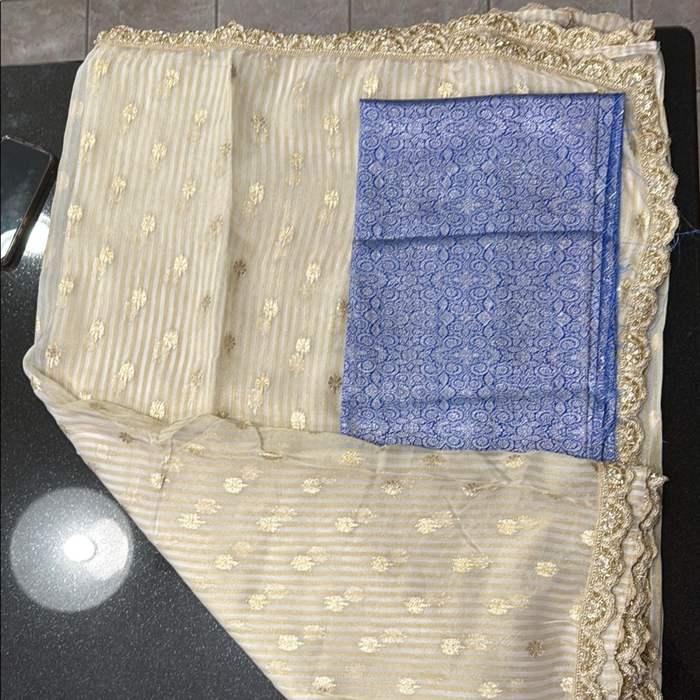 Elegant light weight cream Saree w gold border with Blue blouse